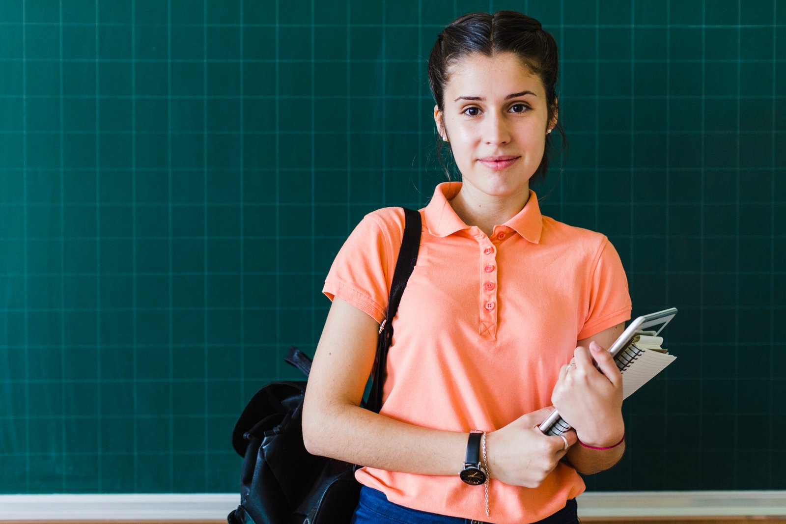 girl with books blackboard
