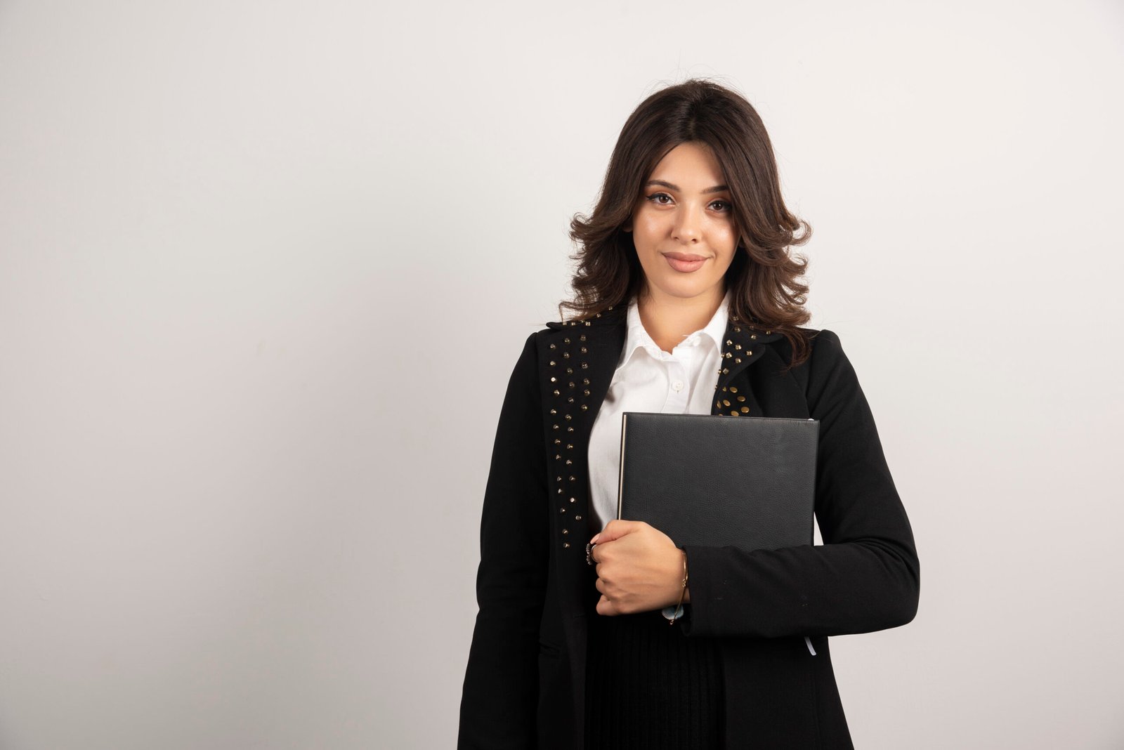 young teacher holding book on white background